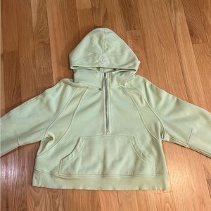 This is a light green half zip scuba jacket from Lululemon.
